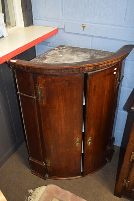 Lot 398 - Substantial Georgian oak two-door bow front...