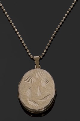 Lot 365 - 750 stamped oval hinged locket, the front with...