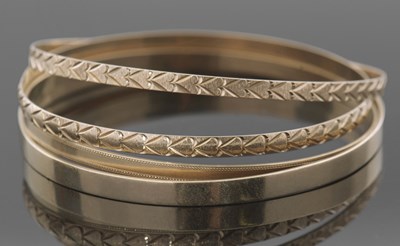 Lot 394 - Four 9ct gold hallmarked bangles, 29.5gms