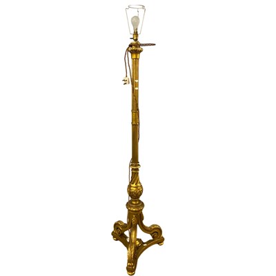 Lot 557 - Early 20th Century ornate gilt wood standard...