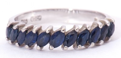 Lot 6 - Modern 18ct white gold and sapphire half hoop...