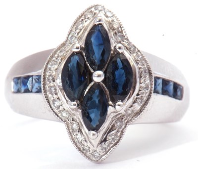 Lot 35 - Modern sapphire and diamond cluster ring...