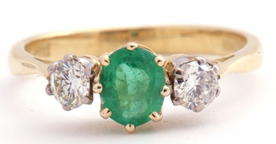 Lot 110 - 18ct gold emerald and diamond three stone ring,...