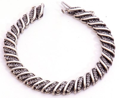 Lot 197 - Precious metal diamond set articulated...