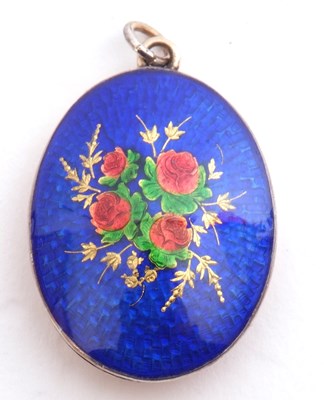 Lot 218 - Blue, red and green enamel locket of oval form,...