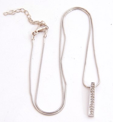 Lot 319 - Modern 9ct white gold and diamond set pendant,...