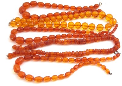 Lot 354 - Five rows of faceted and polished amber beads,...