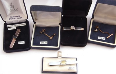 Lot 357 - Mixed Lot: three white metal tie clips and two...
