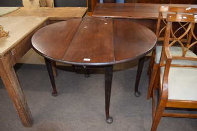 Lot 610 - Georgian mahogany oval drop leaf gate leg...