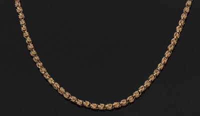 Lot 380 - Unmarked yellow metal fancy link chain, tests...