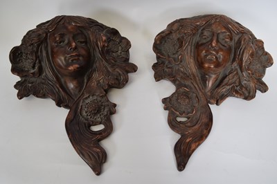Lot 62 - Pair of pottery wall pockets, both modelled in...