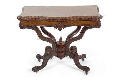 Lot 506 - A Victorian walnut veneered games table with...
