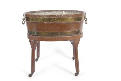 Lot 515 - A 19th Century mahogany and brass bound oval...