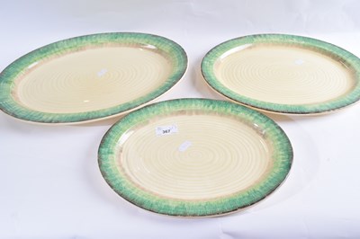 Lot 367 - A graduated set of three Clarice Cliff bizarre...