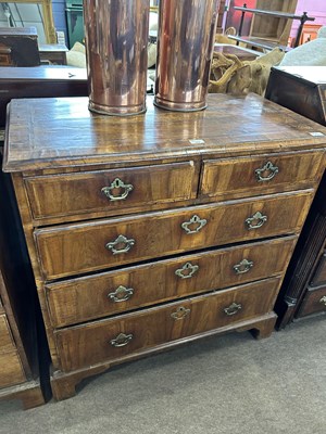 Lot 542 - A George II walnut chest of two short over...