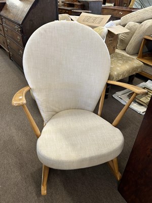 Lot 546 - A Ercol stick back rocking chair with solid...