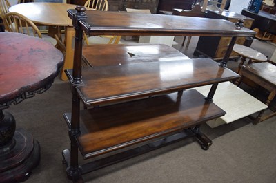 Lot 561 - A 20th Century mahogany three tier buffet...