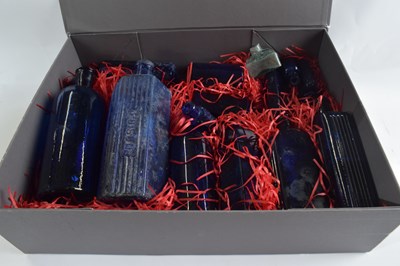 Lot 401 - A collection of mainly blue glass chemists...