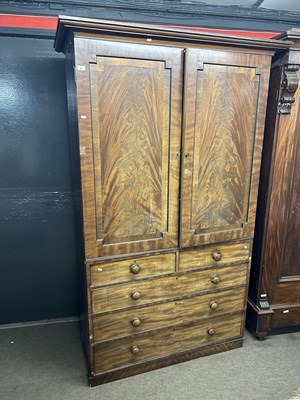 Lot 605 - A 19th Century mahogany former linen press...