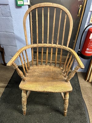 Lot 630 - A 19th Century elm seated stick back Windsor...