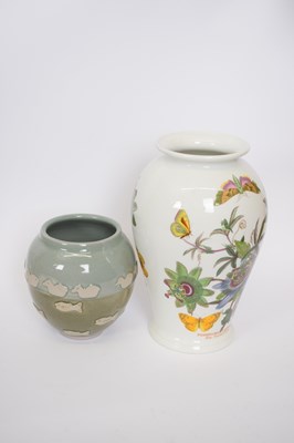 Lot 84 - Art pottery vase of fish and doves in relief...