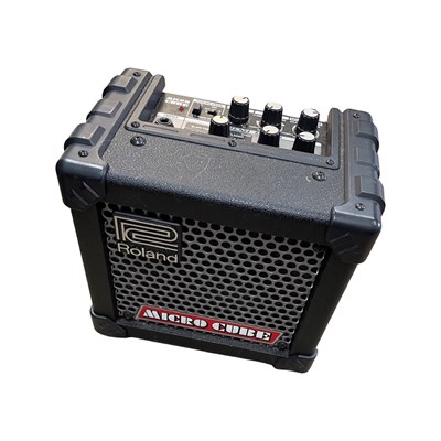 Lot 264 - A Roland Micro Cube practice guitar amplifier,...