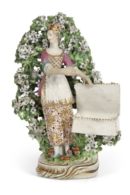 Lot 41 - A Chelsea Derby sweetmeat figure of a young...