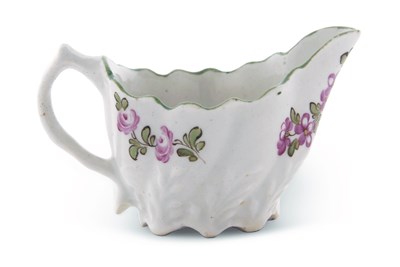 Lot 125 - A Lowestoft porcelain low chelsea ewer...