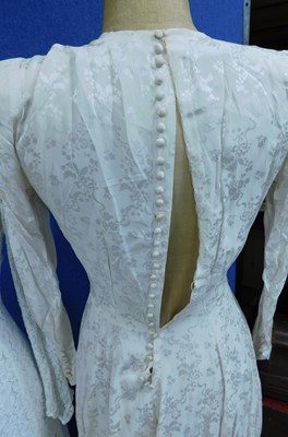 Lot 84 - Two mid 20th Century wedding dresses, one...