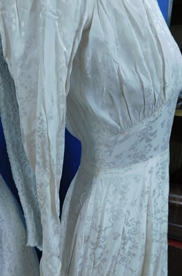 Lot 84 - Two mid 20th Century wedding dresses, one...