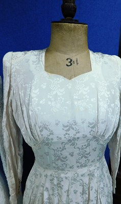 Lot 84 - Two mid 20th Century wedding dresses, one...
